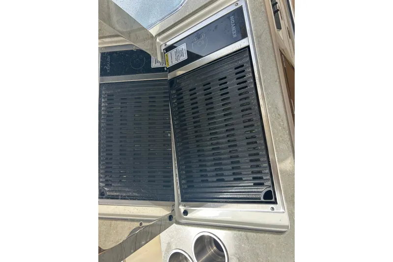  Yacht Photos Pics Built-in grill on 2017 Boston Whaler 320 Vantage boat, featuring Kenyon cooking surface.