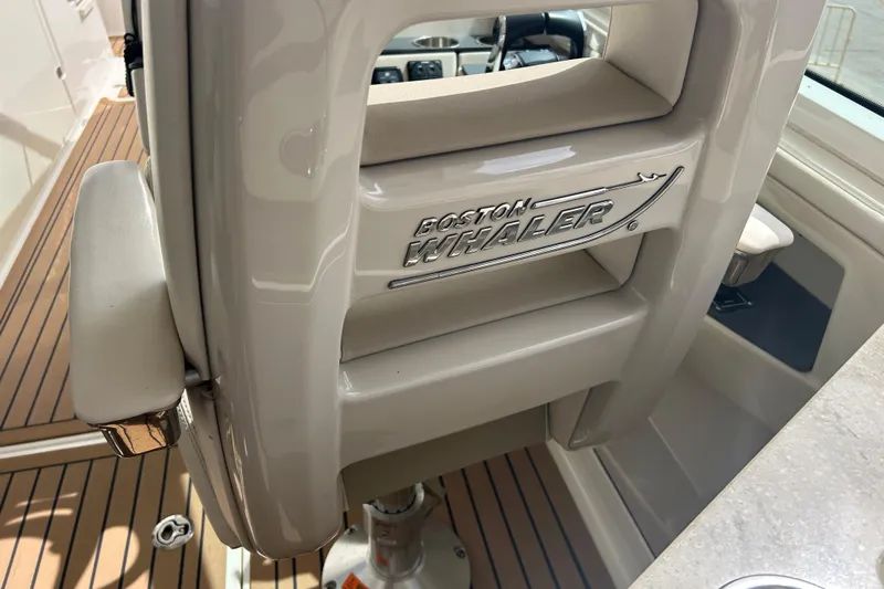  Yacht Photos Pics 2017 Boston Whaler 320 Vantage interior detail with logo and seating.