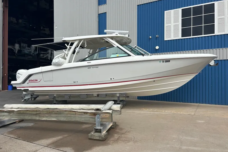  Yacht Photos Pics 2017 Boston Whaler 320 Vantage boat on a lift, dockside view.