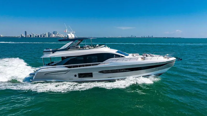 Bongani Yacht Photos Pics 2024 Azimut Fly 78 yacht cruising on open water with city skyline in background.