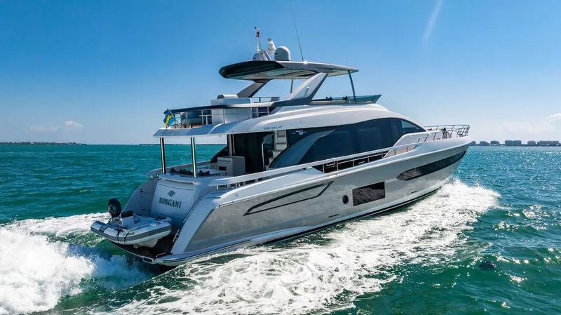 Bongani Yacht Photos Pics 2024 Azimut Fly 78 yacht cruising on open water under clear blue skies.