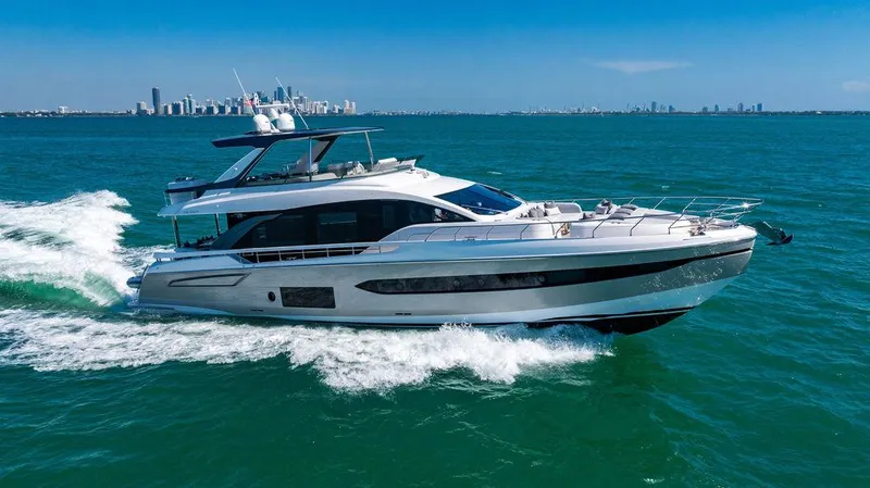 Bongani Yacht Photos Pics 2024 Azimut Fly 78 yacht cruising on open water with city skyline in background.