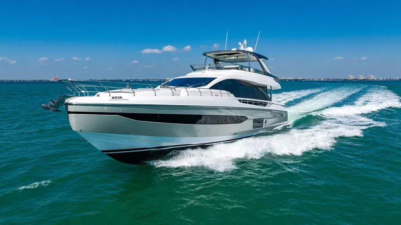 Bongani Yacht Photos Pics 2024 Azimut Fly 78 yacht cruising on open water under clear blue skies.