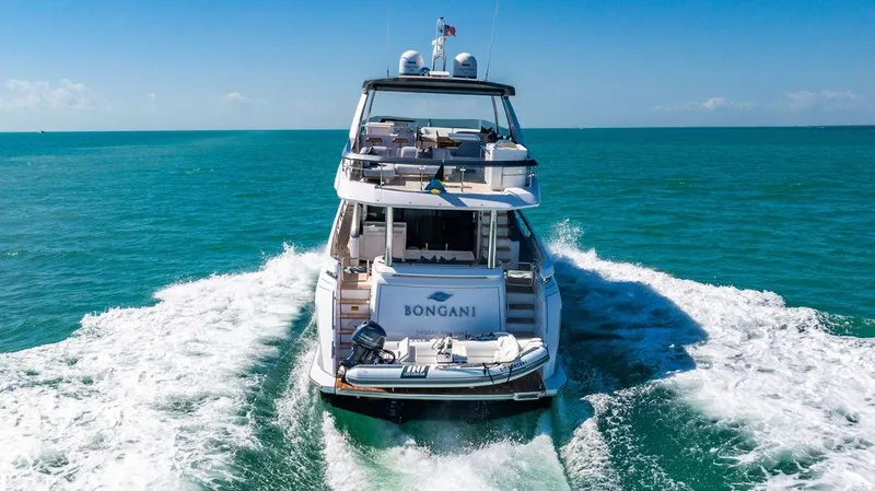 Bongani Yacht Photos Pics 2024 Azimut Fly 78 yacht cruising on open sea, rear view.