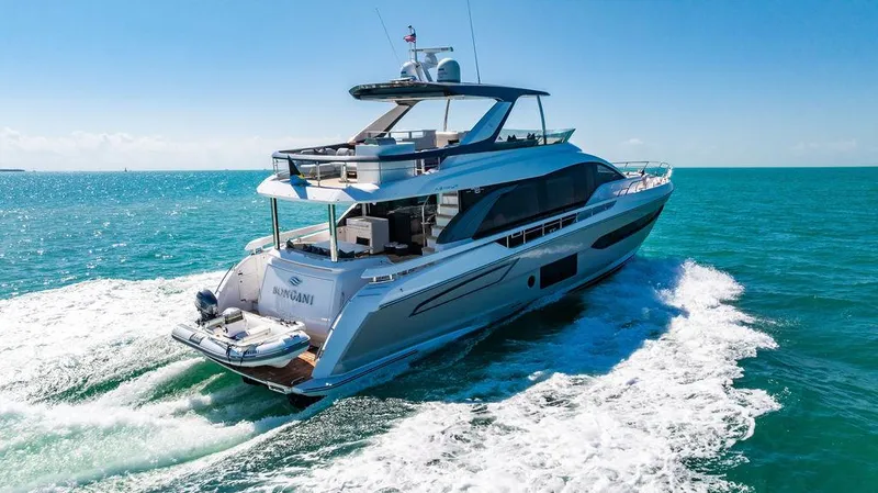 Bongani Yacht Photos Pics 2024 Azimut Fly 78 yacht cruising on open sea under clear blue sky.