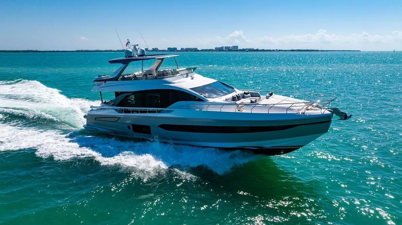 Bongani Yacht Photos Pics 2024 Azimut Fly 78 yacht cruising on turquoise ocean waters.