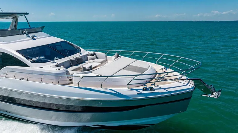 Bongani Yacht Photos Pics 2024 Azimut Fly 78 yacht cruising on clear blue ocean waters.