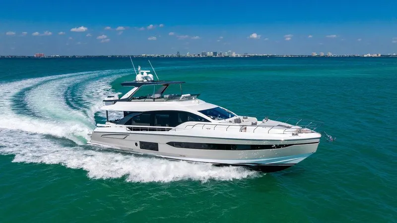Bongani Yacht Photos Pics 2024 Azimut Fly 78 yacht cruising on clear blue ocean waters.
