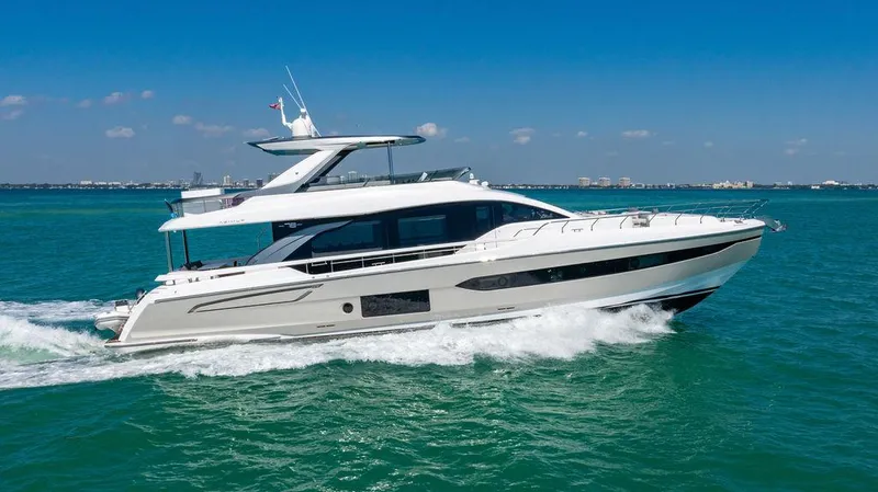 Bongani Yacht Photos Pics 2024 Azimut Fly 78 yacht cruising on clear blue water under a sunny sky.