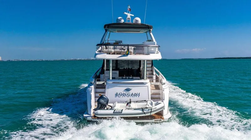 Bongani Yacht Photos Pics 2024 Azimut Fly 78 yacht cruising on open water, rear view.