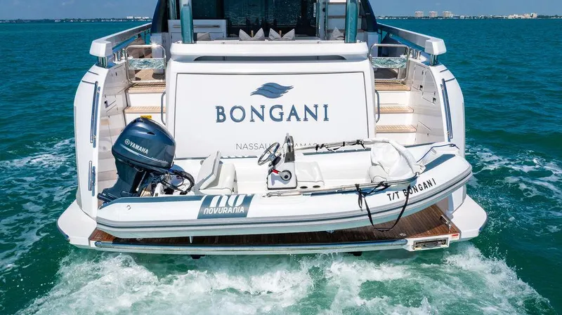 Bongani Yacht Photos Pics 2024 Azimut Fly 78 yacht with tender, cruising in clear blue waters.