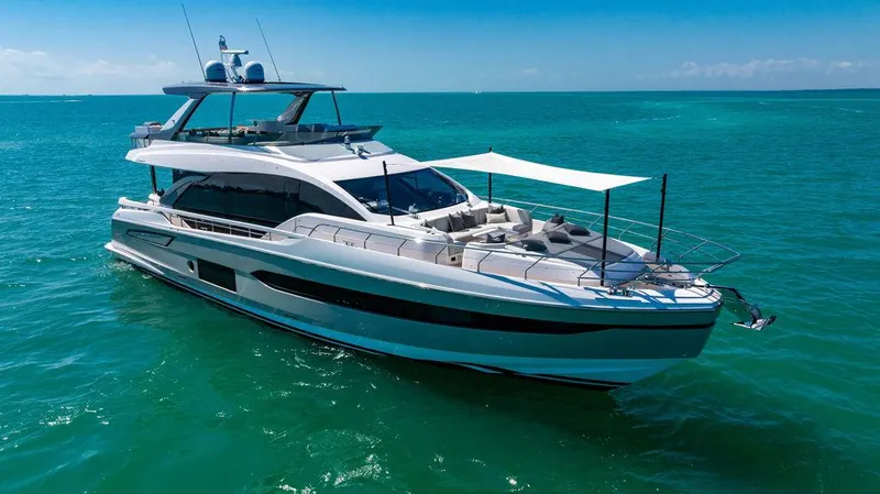 Bongani Yacht Photos Pics 2024 Azimut Fly 78 yacht cruising on turquoise waters under clear blue skies.