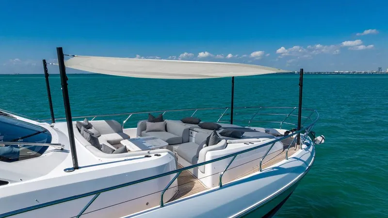 Bongani Yacht Photos Pics 2024 Azimut Fly 78 yacht with sunshade, luxurious seating, and ocean view.