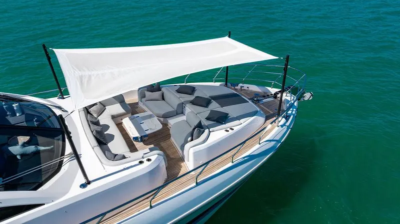 Bongani Yacht Photos Pics 2024 Azimut Fly 78 yacht with elegant deck and sunshade on turquoise water.