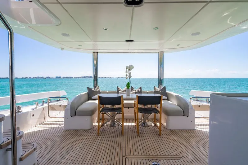 Bongani Yacht Photos Pics Luxurious 2024 Azimut Fly 78 yacht deck with elegant seating and ocean view.