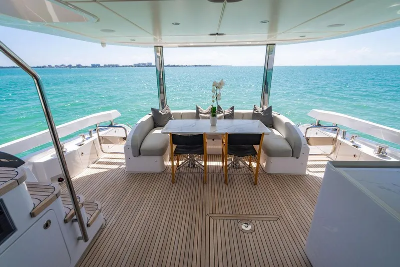 Bongani Yacht Photos Pics Luxurious 2024 Azimut Fly 78 yacht deck with elegant seating and ocean view.