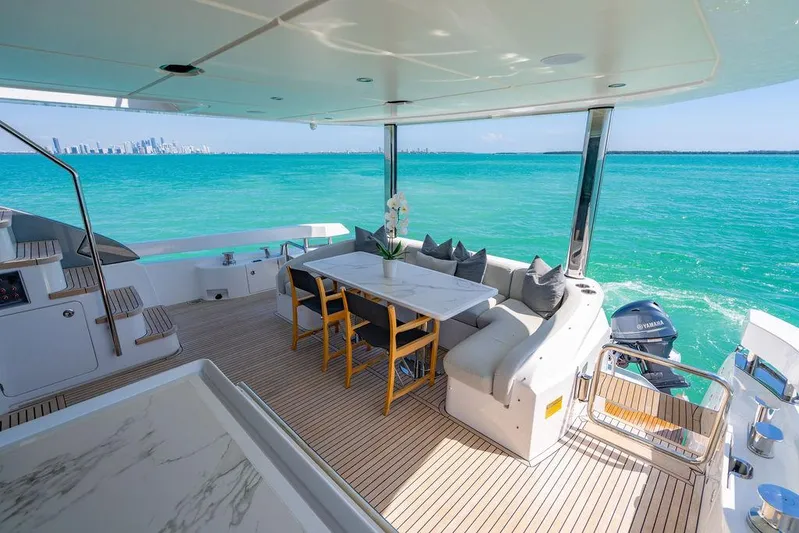 Bongani Yacht Photos Pics Luxurious 2024 Azimut Fly 78 yacht deck with elegant seating and stunning ocean view.