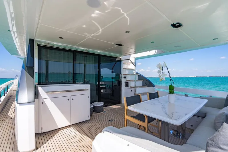 Bongani Yacht Photos Pics Luxurious 2024 Azimut Fly 78 yacht deck with ocean view and elegant seating area.