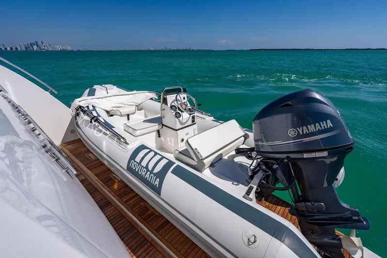 Bongani Yacht Photos Pics 2024 Azimut Fly 78 yacht with Novurania tender and Yamaha outboard motor on turquoise water.