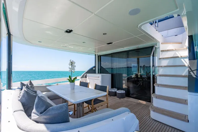 Bongani Yacht Photos Pics Luxurious 2024 Azimut Fly 78 yacht deck with elegant seating and ocean view.