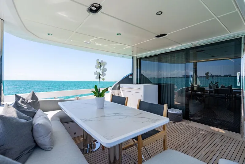 Bongani Yacht Photos Pics Luxurious 2024 Azimut Fly 78 yacht deck with elegant seating and ocean view.