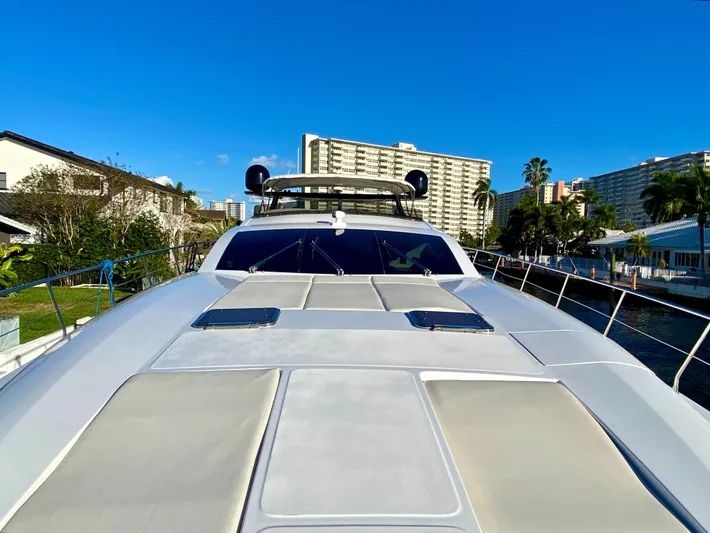  Yacht Photos Pics Luxury Rodriquez 80 Widebody yacht, 2007 model, docked with cityscape background.