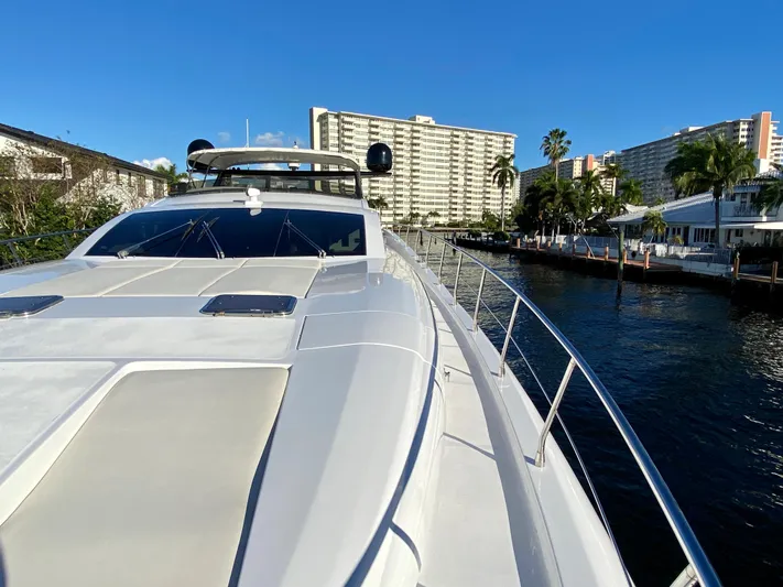  Yacht Photos Pics Luxury Rodriquez 80 Widebody yacht, 2007 model, docked near waterfront buildings under clear blue sky.