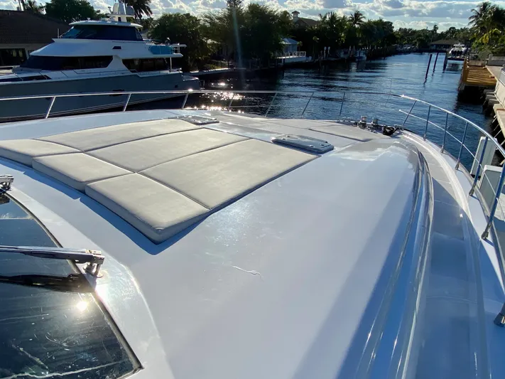  Yacht Photos Pics Luxurious 2007 Rodriquez 80 Widebody yacht with spacious sun deck on a serene waterway.