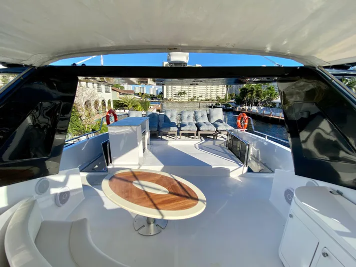  Yacht Photos Pics Luxurious 2007 Rodriquez 80 Widebody yacht deck with seating and table, docked in sunny marina.