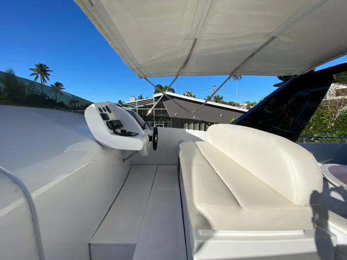  Yacht Photos Pics Luxury yacht deck with seating, Rodriquez 80 Widebody, 2007 model, under clear blue sky.