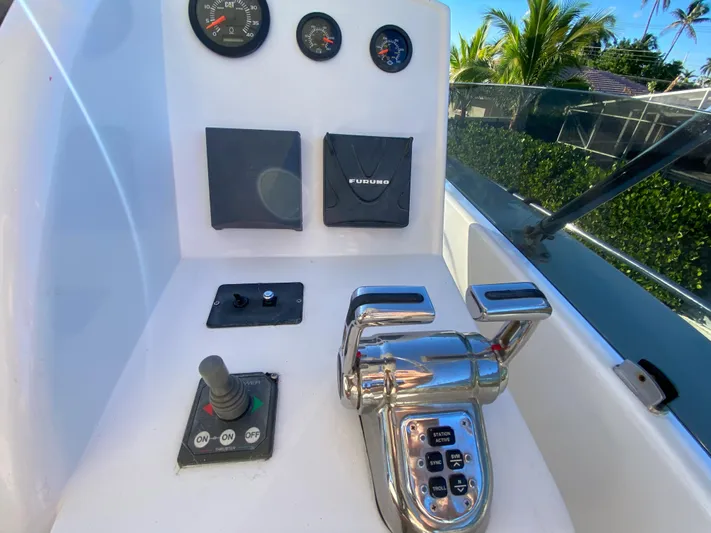  Yacht Photos Pics Control panel of 2007 Rodriquez 80 Widebody yacht with gauges and joystick.