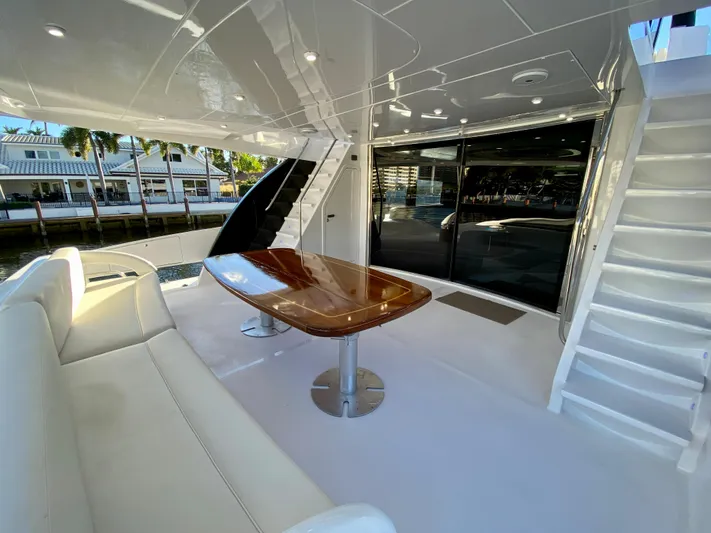  Yacht Photos Pics Luxurious 2007 Rodriquez 80 Widebody yacht deck with elegant seating and table.