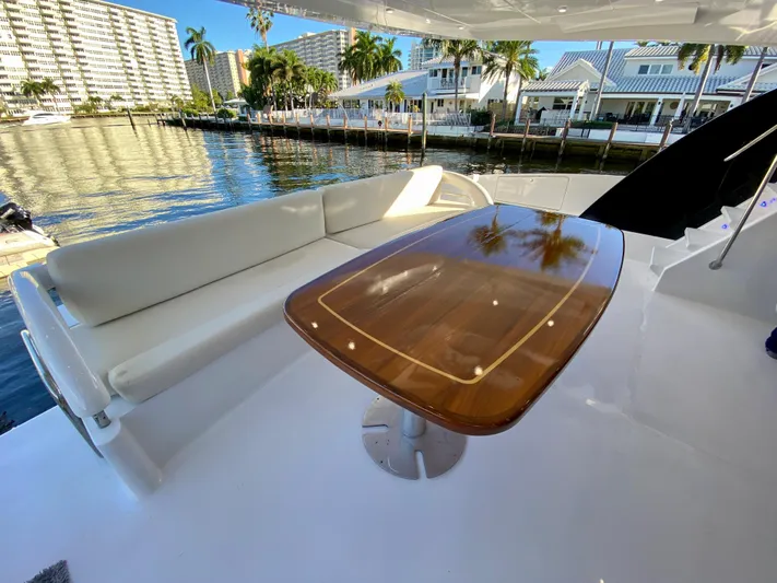  Yacht Photos Pics Luxurious 2007 Rodriquez 80 Widebody yacht with elegant deck seating and polished wooden table.
