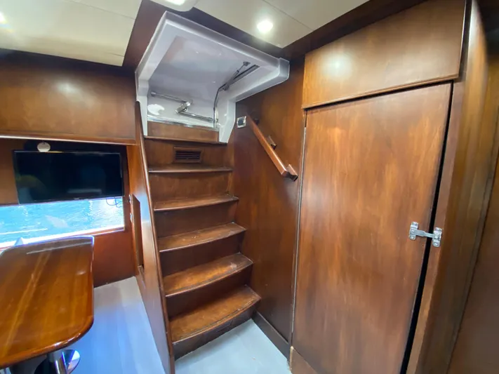  Yacht Photos Pics Interior of 2007 Rodriquez 80 Widebody yacht with wooden stairs and modern design.