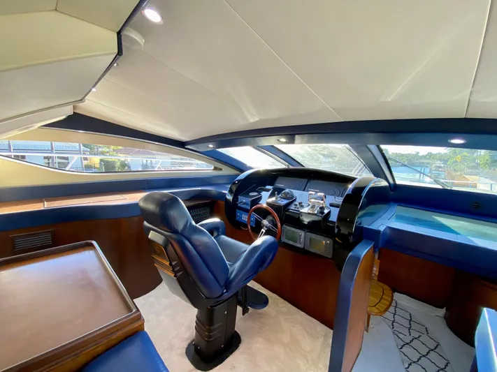  Yacht Photos Pics Luxurious 2007 Rodriquez 80 Widebody yacht helm with leather seating and modern controls.