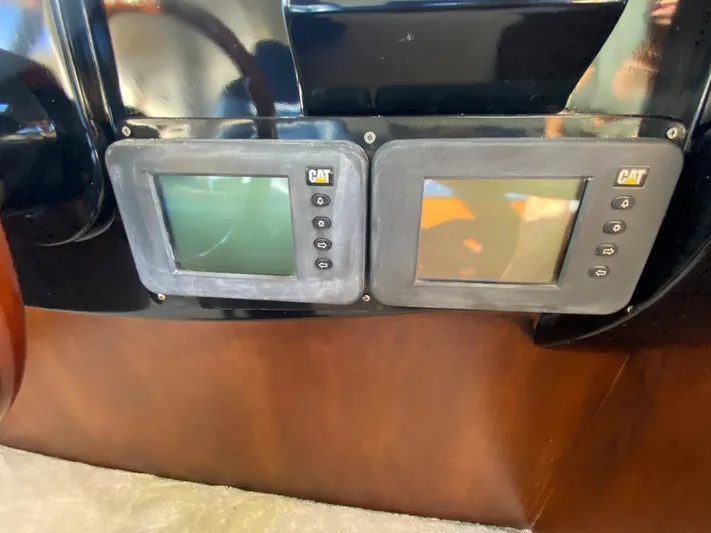  Yacht Photos Pics Control panel of a 2007 Rodriquez 80 Widebody yacht with dual CAT displays.