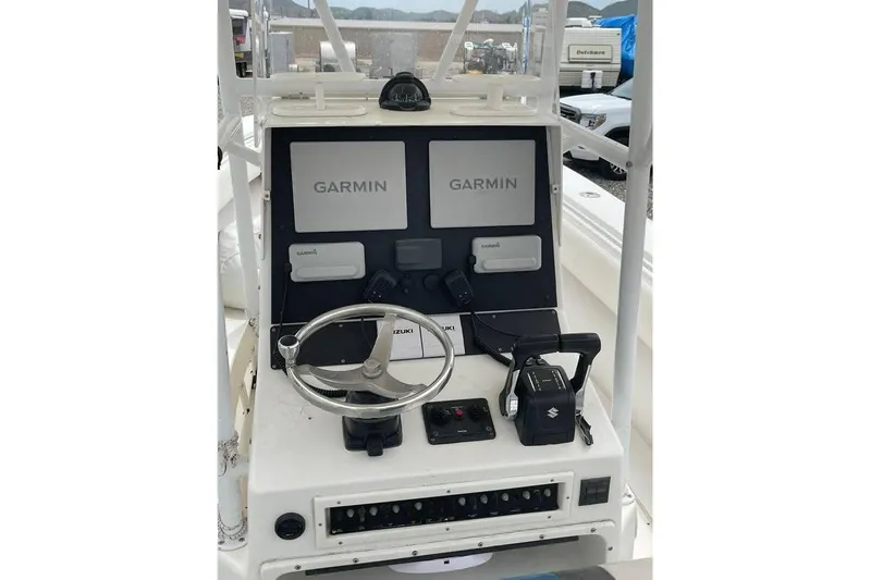  Yacht Photos Pics Center console of 2001 Contender 27 Open CC with Garmin navigation displays.