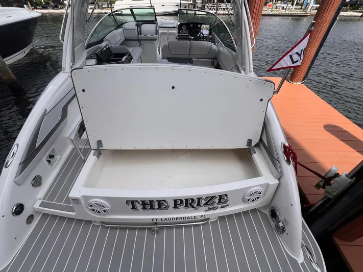  Yacht Photos Pics 2020 Formula 310 Bowrider boat docked, open storage, "The Prize" name visible.