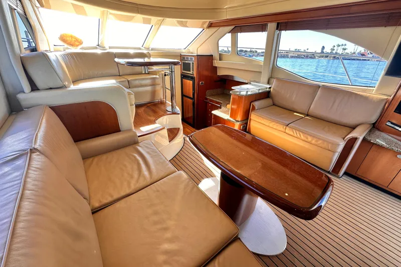 Lanakilla Yacht Photos Pics Luxurious interior of 2005 Sea Ray 420 Sedan Bridge yacht with leather seating and wood accents.