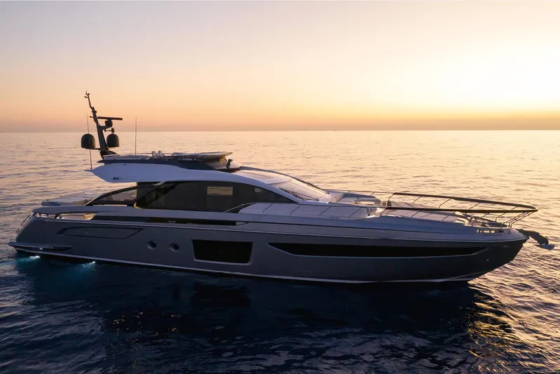  Yacht Photos Pics 2022 Azimut S8 yacht cruising at sunset on calm ocean waters.