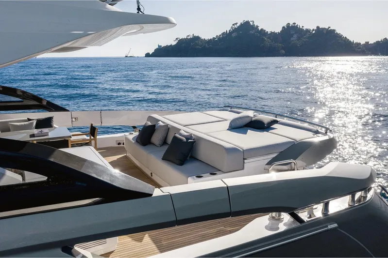  Yacht Photos Pics Luxurious 2022 Azimut S8 yacht with sun deck, ocean view, and scenic island backdrop.