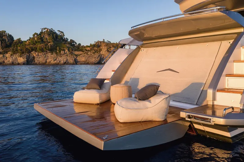  Yacht Photos Pics Luxurious 2022 Azimut S8 yacht with elegant deck seating at sunset.