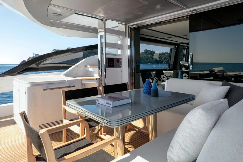  Yacht Photos Pics Luxurious 2022 Azimut S8 yacht deck with elegant dining area and ocean view.