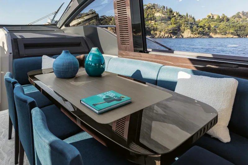  Yacht Photos Pics Luxurious interior of 2022 Azimut S8 yacht with elegant table and decorative vases.