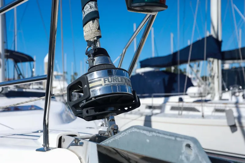 Matt's Dinghy Yacht Photos Pics Close-up of a 2009 Hunter 45 Center Cockpit sailboat's furling system in a marina.
