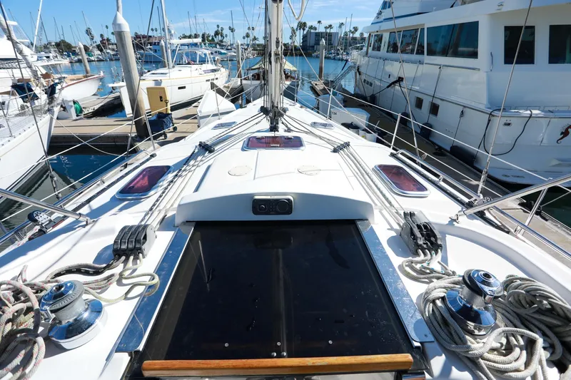 Matt's Dinghy Yacht Photos Pics 2009 Hunter 45 Center Cockpit sailboat docked at marina, showcasing deck and rigging.