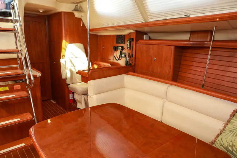 Matt's Dinghy Yacht Photos Pics Luxurious interior of 2009 Hunter 45 Center Cockpit yacht with wood finishes and seating area.