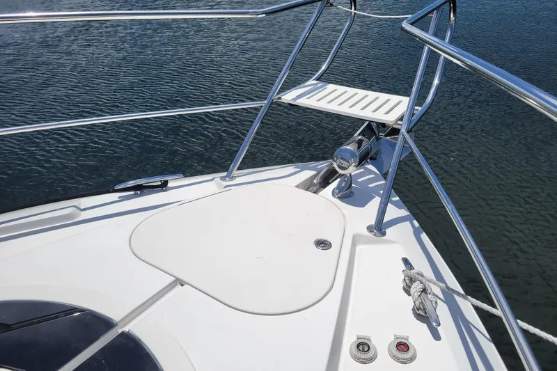 Isabella IV Yacht Photos Pics Bow of 2012 Four Winns V435 yacht with stainless steel railings on water.