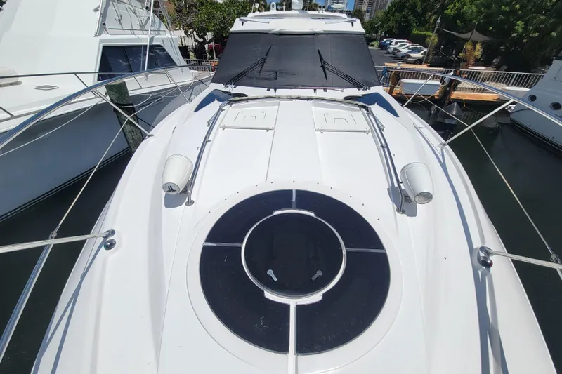 Isabella IV Yacht Photos Pics 2012 Four Winns V435 yacht deck with circular hatch and sleek design.