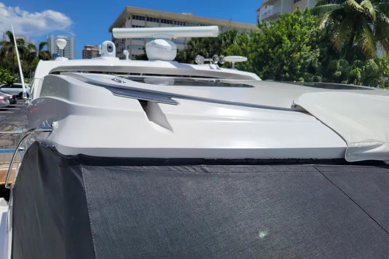 Isabella IV Yacht Photos Pics 2012 Four Winns V435 yacht exterior with sleek design, docked under clear blue sky.